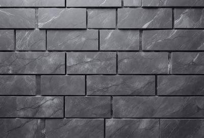The primary subject of the image is a black brick wall. The setting is a dark room, and the visual style is a close-up of the brick wall. The colors and mood of the image are dark and moody, with the black brick wall being the main focus.