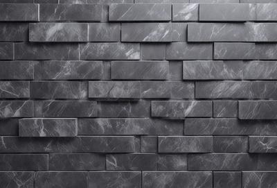 The primary subject of the image is a black brick wall. The setting is a room with a black brick wall as the main focus. The visual style is a close-up of the brick wall, showcasing its texture and pattern. The colors and mood of the image are predominantly dark and moody, with the black brick wall being the main element that contributes to the atmosphere.