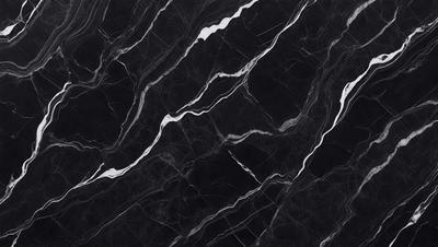 The primary subject of the image is a black marble countertop. The setting is a kitchen, with the countertop being the main focus of the scene. The visual style is a close-up of the marble countertop, showcasing its texture and pattern. The colors and mood of the image are predominantly dark, with the black marble countertop being the main source of contrast.