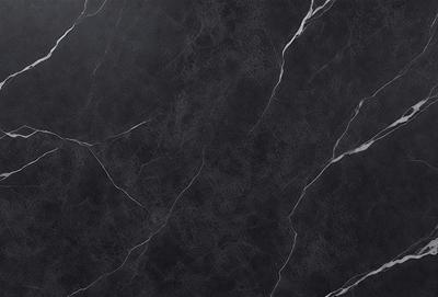 The primary subject of the image is a black marble countertop. The setting is a kitchen, with the countertop being the main focus of the scene. The visual style is a close-up of the marble countertop, showcasing its texture and pattern. The colors and mood of the image are predominantly dark, with the black marble countertop being the main source of contrast.