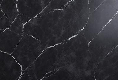 The primary subject of the image is a black marble countertop. The setting is a kitchen, with the countertop being the main focus of the scene. The visual style is a close-up of the marble countertop, showcasing its texture and pattern. The colors and mood of the image are dark and moody, with the black marble countertop being the dominant color.