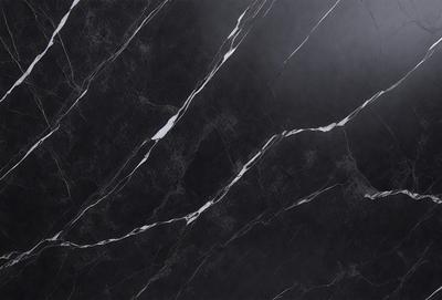 The primary subject of the image is a marble countertop with a black and white pattern. The setting is a kitchen, and the visual style is a close-up of the countertop. The dominant colors are black and white, creating a classic and elegant atmosphere.