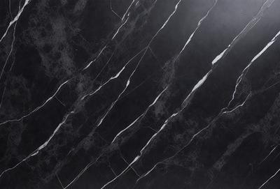 The primary subject of the image is a black marble countertop with white veins running through it. The setting is a kitchen, and the visual style is a close-up of the marble countertop. The colors and mood of the image are predominantly black and white, giving it a sleek and modern appearance.
