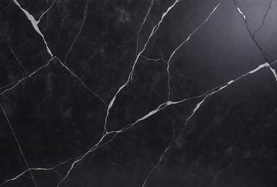 The primary subject of the image is a black marble countertop. The setting is a kitchen, with the countertop being the main focus of the scene. The visual style is a close-up of the marble countertop, showcasing its texture and details. The colors and mood of the image are predominantly dark, with the black marble countertop being the main source of contrast and visual interest.
