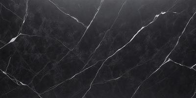 The primary subject of the image is a black marble countertop. The setting is a kitchen, with the countertop being the main focus of the scene. The visual style is a close-up of the marble countertop, showcasing its texture and details. The colors and mood of the image are predominantly dark, with the black marble countertop being the main source of contrast and visual interest.