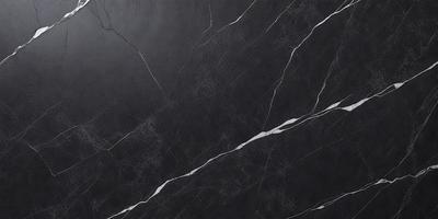 The primary subject of the image is a black marble countertop. The setting is a kitchen, with the countertop being the main focus of the scene. The visual style is a close-up of the marble countertop, showcasing its texture and details. The colors and mood of the image are predominantly dark, with the black marble countertop being the main source of contrast and visual interest.
