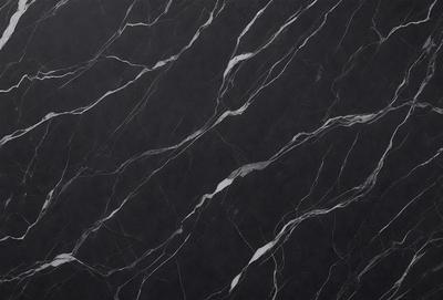 The primary subject of the image is a marble countertop with a black background. The countertop features a pattern of white and black swirls, giving it a unique and elegant appearance. The visual style of the image is a close-up of the marble countertop, showcasing its intricate design. The colors and mood of the image are predominantly black and white, creating a sophisticated and timeless atmosphere.