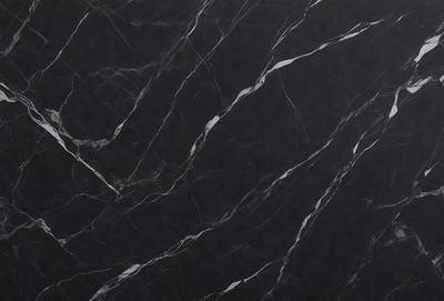 The primary subject of the image is a marble countertop. The setting is a black marble countertop, which serves as the background. The visual style is a close-up of the marble countertop, showcasing its texture and pattern. The colors and mood of the image are predominantly black, giving it a sleek and modern appearance.