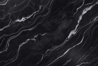 The primary subject of the image is a black marble countertop. The setting is a kitchen, with the countertop being the main focus of the scene. The visual style is a close-up of the marble countertop, showcasing its texture and pattern. The colors and mood of the image are predominantly dark, with the black marble countertop being the main source of contrast.