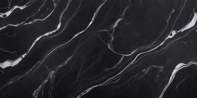 The image features a black marble countertop with a pattern of swirls and waves. The countertop appears to be a part of a kitchen or bathroom setting. The visual style of the image is a close-up of the marble countertop, showcasing its unique texture and design. The colors and mood of the image are predominantly dark, with the black marble providing a striking contrast against the surrounding environment.