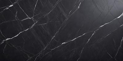 The primary subject of the image is a black marble countertop. The setting is a kitchen, with the countertop being the main focus of the scene. The visual style is a close-up of the marble countertop, showcasing its texture and pattern. The colors and mood of the image are predominantly dark, with the black marble countertop being the main source of contrast.