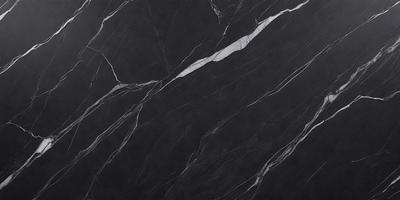 The primary subject of the image is a black marble countertop. The setting is a kitchen, with the countertop being the main focus of the scene. The visual style is a close-up of the marble countertop, showcasing its texture and pattern. The colors and mood of the image are predominantly dark, with the black marble countertop being the main source of contrast.