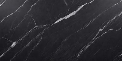 The primary subject of the image is a black marble countertop. The setting is a kitchen, with the countertop being the main focus of the scene. The visual style is a close-up of the marble countertop, showcasing its texture and pattern. The colors and mood of the image are predominantly dark, with the black marble countertop being the main source of contrast.