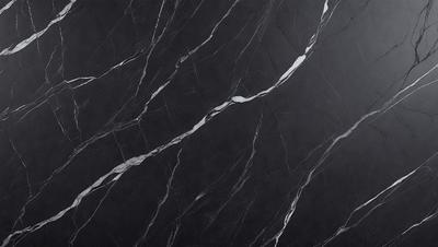 The primary subject of the image is a marble wall with a black background. The visual style is a close-up of the marble wall, showcasing its texture and pattern. The colors and mood of the image are predominantly black and white, giving it a classic and elegant appearance.
