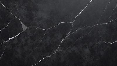 The primary subject of the image is a black marble countertop with visible cracks and holes. The setting is a kitchen, and the visual style is a close-up of the marble countertop. The dominant colors are black and white, and the overall atmosphere is elegant and sophisticated.