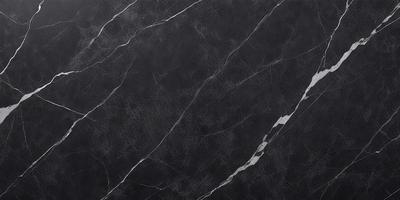 The primary subject of the image is a black marble countertop. The setting is a kitchen, with the countertop being the main focus of the scene. The visual style is a close-up of the marble countertop, showcasing its texture and pattern. The colors and mood of the image are predominantly dark, with the black marble countertop being the main source of contrast.