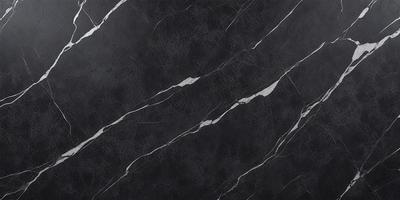 The primary subject of the image is a black marble countertop. The setting is a kitchen, with the countertop being the main focus of the scene. The visual style is a close-up of the marble countertop, showcasing its texture and pattern. The colors and mood of the image are predominantly dark, with the black marble providing a striking contrast against the lighter background.