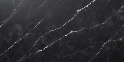 The primary subject of the image is a black marble countertop. The setting is a kitchen, with the countertop being the main focus of the scene. The visual style is a close-up of the marble countertop, showcasing its texture and details. The colors and mood of the image are predominantly dark, with the black marble countertop being the main source of contrast and visual interest.