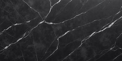 The primary subject of the image is a black marble countertop. The setting is a kitchen, with the countertop being the main focus of the scene. The visual style is a close-up of the marble countertop, showcasing its texture and pattern. The colors and mood of the image are predominantly dark, with the black marble countertop being the main source of contrast.