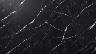 The primary subject of the image is a marble countertop with a black and white pattern. The setting is a kitchen, and the visual style is a close-up of the countertop. The colors and mood of the image are predominantly black and white, giving it a classic and elegant appearance.