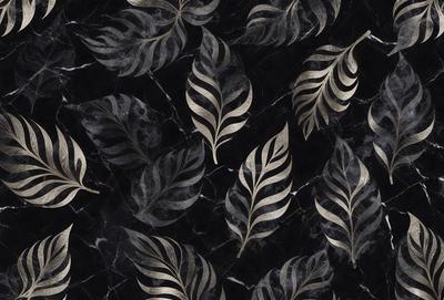 The primary subject of the image is a pattern of gold and black leaves on a black background. The setting is a marble surface, which adds a luxurious and elegant touch to the overall visual style. The leaves are arranged in a decorative manner, creating a sense of depth and dimension. The colors in the image are predominantly black and gold, giving the scene a sophisticated and timeless appearance.