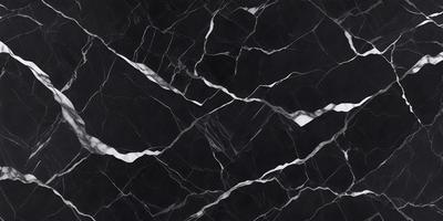 The primary subject of the image is a black marble countertop. The setting is a kitchen, with the countertop being the main focus of the scene. The visual style is a close-up of the marble countertop, showcasing its texture and pattern. The colors and mood of the image are predominantly dark, with the black marble countertop being the main source of contrast.