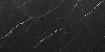 The primary subject of the image is a black marble countertop. The setting is a kitchen, with the countertop being the main focus of the scene. The visual style is a close-up of the marble countertop, showcasing its texture and pattern. The colors and mood of the image are predominantly dark, with the black marble countertop being the main source of contrast.