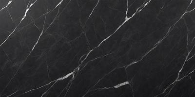 The primary subject of the image is a marble countertop with a black and white pattern. The setting is a kitchen, and the visual style is a close-up of the countertop. The colors and mood of the image are predominantly black and white, giving it a classic and elegant appearance.