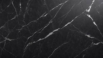 The primary subject of the image is a close-up of a marble countertop. The setting is a black background, which contrasts with the marble countertop. The visual style is a photo, showcasing the natural texture and patterns of the marble. The colors and mood of the image are predominantly black and white, giving it a classic and elegant appearance.