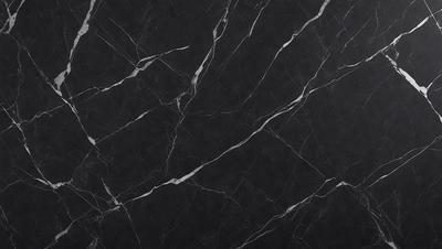 The primary subject of the image is a black marble countertop. The setting is a kitchen, with the countertop being the main focus of the scene. The visual style is a close-up of the marble countertop, showcasing its texture and pattern. The colors and mood of the image are predominantly dark, with the black marble countertop being the main source of contrast.