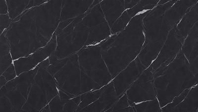 The primary subject of the image is a marble countertop. The setting is a kitchen, with the countertop being the main focus of the scene. The visual style is a close-up of the marble countertop, showcasing its texture and pattern. The colors and mood of the image are predominantly black, giving it a sleek and modern appearance.