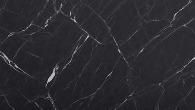 The primary subject of the image is a marble countertop. The setting is a kitchen, with the countertop being the main focus of the scene. The visual style is a close-up of the marble countertop, showcasing its texture and pattern. The colors and mood of the image are predominantly black, giving it a sleek and modern appearance.