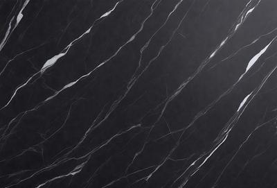 The primary subject of the image is a black marble countertop. The setting is a kitchen, with the countertop being the main focus of the scene. The visual style is a close-up of the marble countertop, showcasing its texture and pattern. The colors and mood of the image are predominantly dark, with the black marble countertop being the main source of contrast.