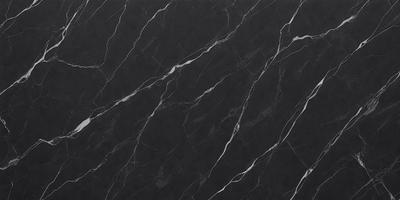 The primary subject of the image is a marble countertop. The setting is a kitchen, with the countertop being the main focus of the scene. The visual style is a close-up of the marble countertop, showcasing its texture and pattern. The colors and mood of the image are predominantly black, giving it a sleek and modern appearance.