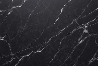 The primary subject of the image is a close-up of a marble countertop. The setting is a kitchen, with the countertop being the main focus of the scene. The visual style is a photo, capturing the intricate details of the marble surface. The colors and mood of the image are predominantly black and white, giving it a classic and elegant appearance.