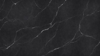 The primary subject of the image is a close-up of a marble countertop. The setting is a kitchen, with the marble countertop being the main focus of the scene. The visual style is a photo, showcasing the natural texture and beauty of the marble. The colors and mood of the image are predominantly black and white, giving it a classic and elegant appearance.