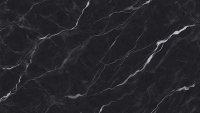 The primary subject of the image is a black marble countertop. The setting is a kitchen, with the countertop being the main focus of the scene. The visual style is a close-up of the marble countertop, showcasing its texture and pattern. The colors and mood of the image are predominantly dark, with the black marble countertop being the main source of contrast.