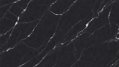 The primary subject of the image is a black marble countertop. The setting is a kitchen, with the countertop being the main focus of the scene. The visual style is a close-up of the marble countertop, showcasing its texture and pattern. The colors and mood of the image are predominantly dark, with the black marble countertop being the main source of contrast.