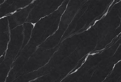 The primary subject of the image is a black marble countertop. The setting is a kitchen, with the countertop being the main focus of the scene. The visual style is a close-up of the marble countertop, showcasing its texture and pattern. The colors and mood of the image are predominantly dark, with the black marble countertop being the main source of contrast.