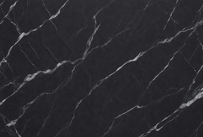 The primary subject of the image is a marble countertop. The setting is a kitchen, with the countertop being the main focus of the scene. The visual style is a close-up of the marble countertop, showcasing its texture and pattern. The colors and mood of the image are predominantly black, giving it a sleek and modern appearance.