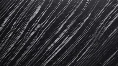 The primary subject of the image is a black and white pattern, which appears to be a marble or stone texture. The setting is a black background, which contrasts with the pattern. The visual style is a close-up of the pattern, showcasing its intricate details. The colors and mood of the image are predominantly dark and moody, with the black and white pattern creating a sense of depth and contrast.