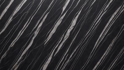 The primary subject of the image is a black and white patterned surface, which appears to be a marble or stone texture. The setting is a dark background, which contrasts with the patterned surface. The visual style is a close-up of the pattern, showcasing the intricate details of the design. The colors and mood of the image are predominantly dark, with the black and white pattern creating a sense of depth and contrast.