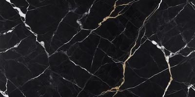 The primary subject of the image is a black and gold marble countertop. The setting is a kitchen, with the countertop being the main focus of the scene. The visual style is a close-up of the marble countertop, showcasing its intricate patterns and textures. The dominant colors are black and gold, creating a luxurious and elegant atmosphere.