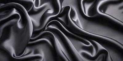The primary subject of the image is a close-up of a black fabric, possibly a piece of clothing or a curtain. The setting is a dark background, which emphasizes the fabric's texture and pattern. The visual style is a black and white photo, which adds a classic and timeless feel to the image. The colors and mood are predominantly dark and moody, with the black fabric serving as the focal point of the scene.
