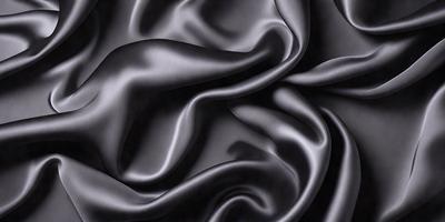 The primary subject of the image is a close-up of a black fabric, possibly a piece of silk or velvet. The setting is a dark background, which emphasizes the fabric's texture and pattern. The visual style is a black and white photo, which adds a timeless and classic feel to the image. The colors and mood are predominantly dark and moody, with the black fabric serving as the focal point of the scene.