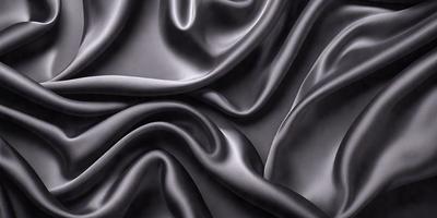 The primary subject of the image is a close-up of a black fabric, possibly a piece of silk or velvet. The setting is a black background, which emphasizes the fabric's texture and pattern. The visual style is a close-up, which highlights the fabric's intricate details. The colors and mood of the image are predominantly black, creating a dramatic and sophisticated atmosphere.