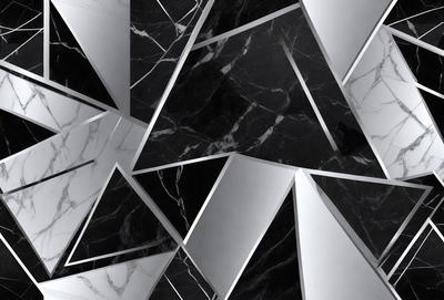 The primary subject of the image is a black and white marble pattern. The setting is a white wall, and the visual style is a patterned design. The dominant colors are black and white, creating a classic and elegant atmosphere.