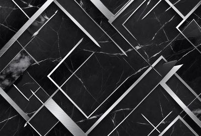 The primary subject of the image is a black and white marble pattern. The setting is a black and white marble surface, which serves as the background. The visual style is a black and white photo, creating a classic and elegant atmosphere. The colors and mood are predominantly black and white, with a touch of sophistication and timelessness.