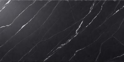 The primary subject of the image is a black marble countertop. The setting is a kitchen, with the countertop being the main focus of the scene. The visual style is a close-up of the marble countertop, showcasing its texture and pattern. The colors and mood of the image are predominantly dark, with the black marble countertop being the main source of contrast and visual interest.