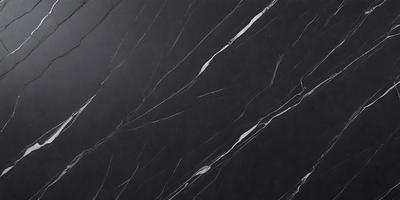 The primary subject of the image is a black marble countertop. The setting is a kitchen, with the countertop being the main focus of the scene. The visual style is a close-up of the marble countertop, showcasing its texture and pattern. The colors and mood of the image are predominantly dark, with the black marble countertop being the main source of contrast.